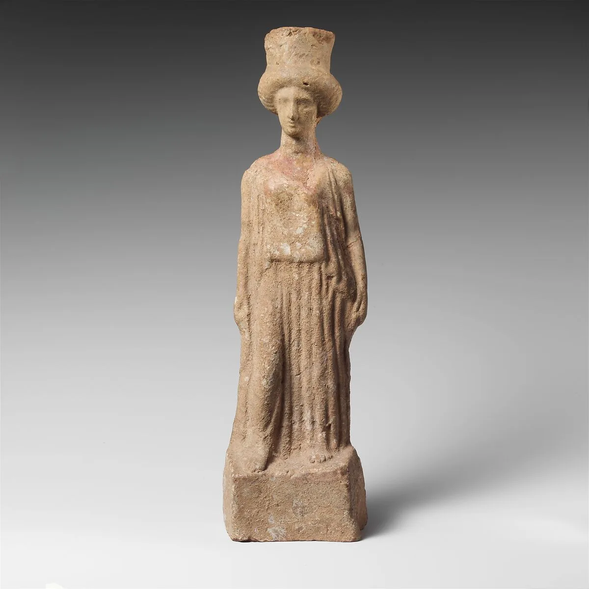 Terracotta statuette of a standing woman — Unknown