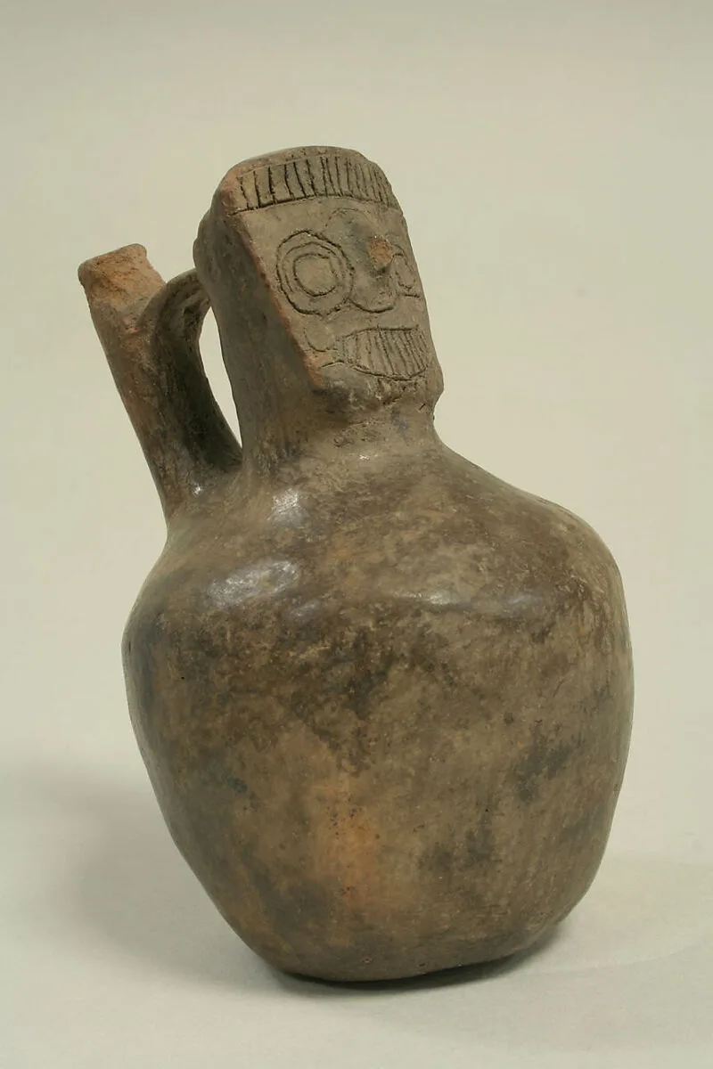 Bridge and Spout Bottle with Head — Unknown