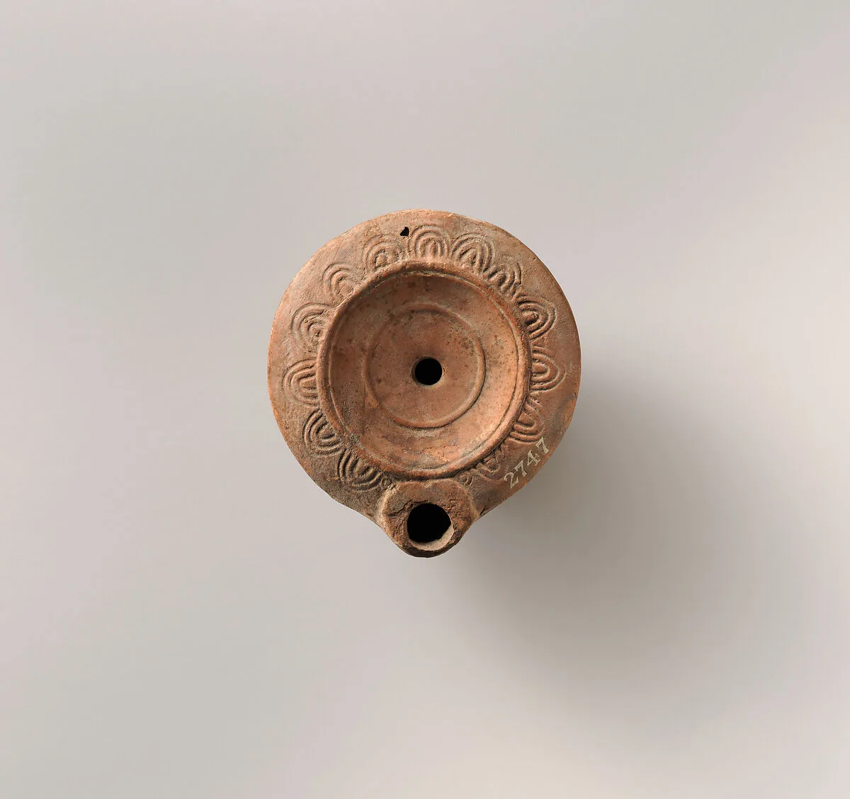 Terracotta oil lamp — Unknown