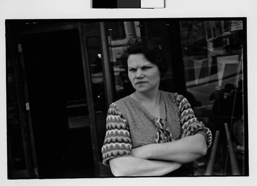 [Two 35mm Film Frames: Woman Outside Main Street Sports Shop, Ossining, New York]
