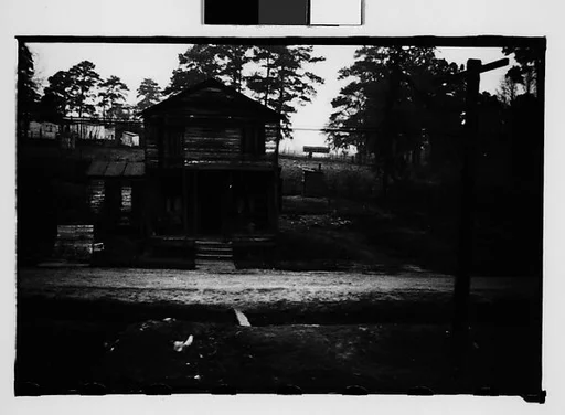 [Wooden House by Railroad Tracks, From Train, Savannah, Georgia]