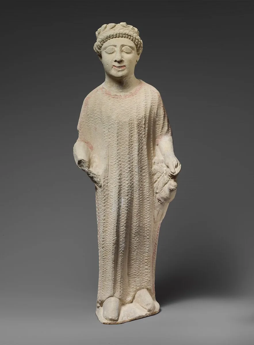 Limestone statuette of a boy holding a dove — Unknown