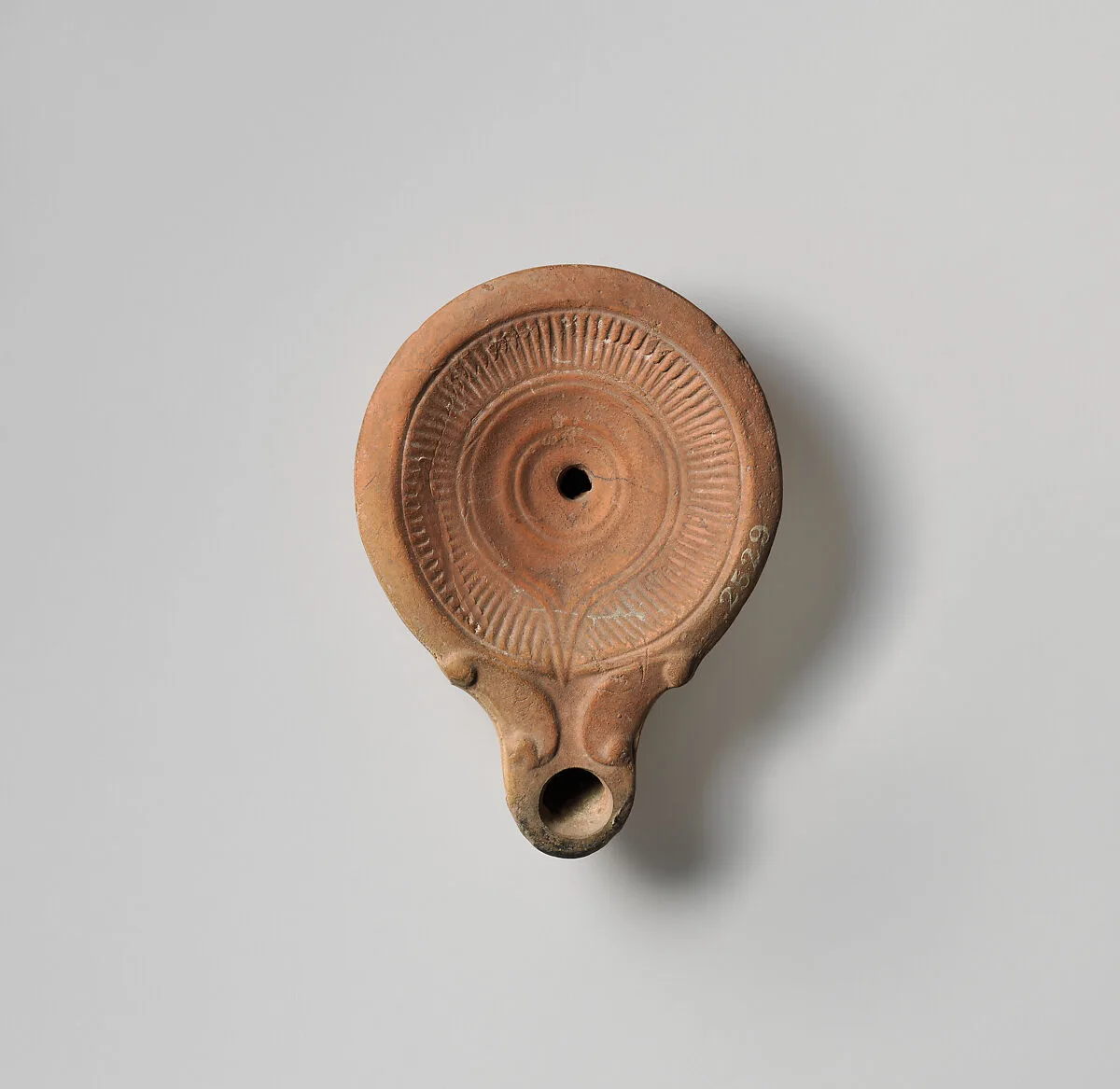 Terracotta oil lamp — Unknown