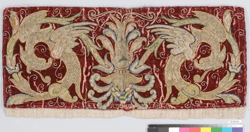 Fantastical birds against a red ground