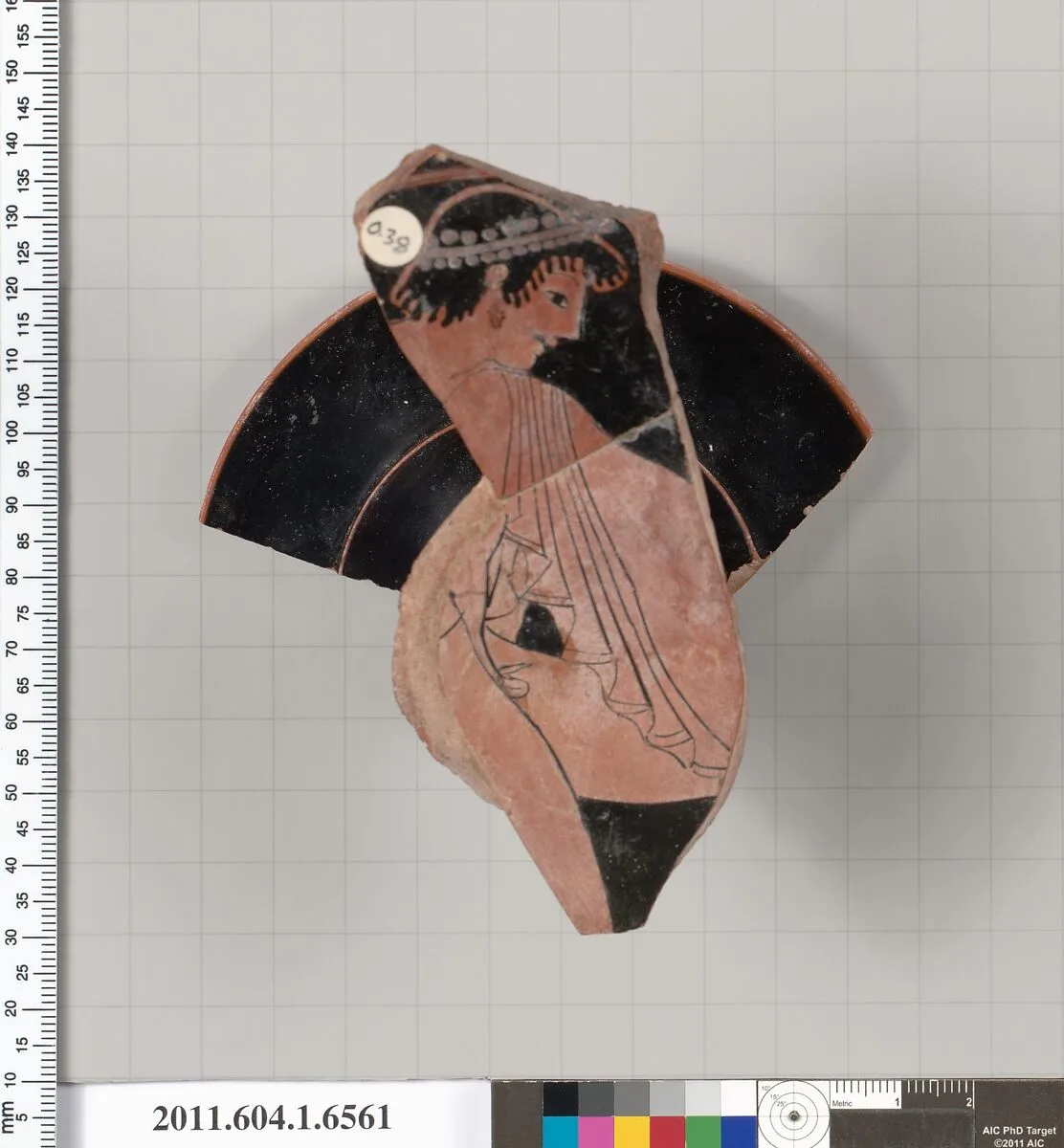 Terracotta fragment of a kylix (drinking cup) — Colmar Painter