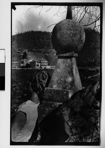 [Georgette Maury Reclining Against Stone Marker, Juan-les-Pins, France]