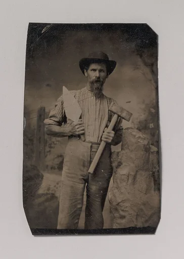 [Mason (?) Holding a Trowel and Sledgehammer]