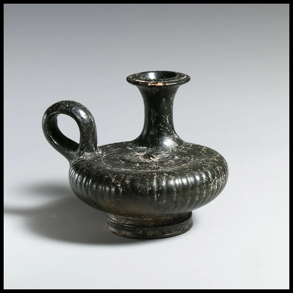 Terracotta guttus (flask with handle and vertical spout) with a depiction of a dog — Unknown