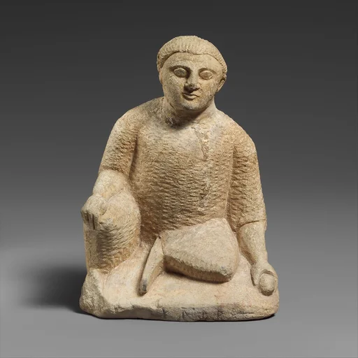 Limestone statuette of a temple boy