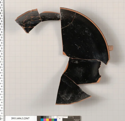 Terracotta fragment of a kylix: eye-cup (drinking cup)
