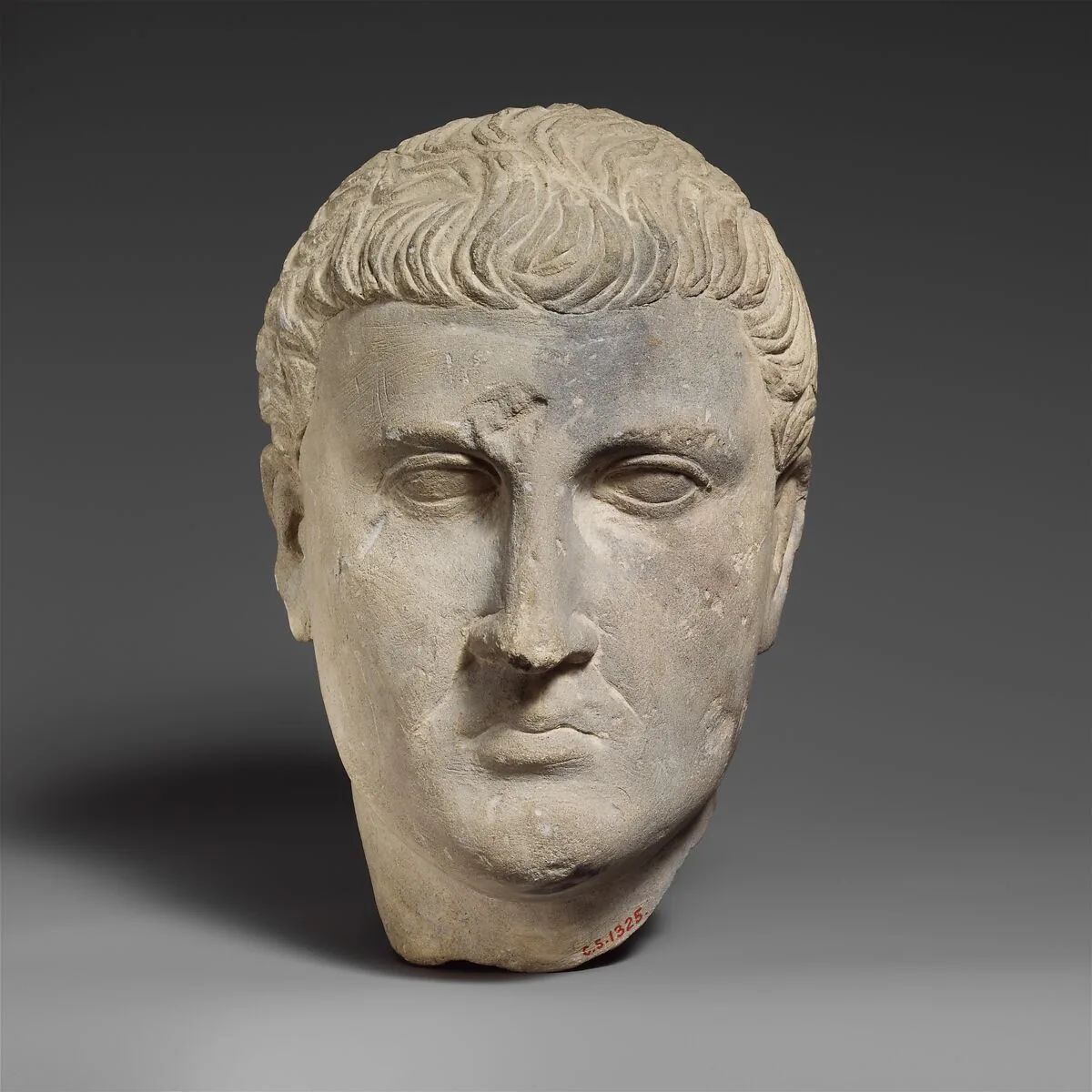 Limestone male head — Unknown