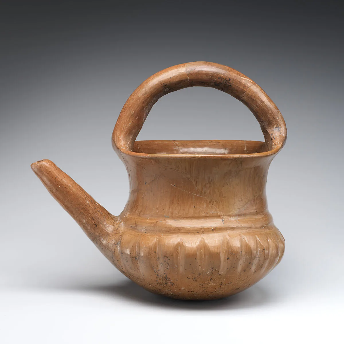 Spouted jar with a basket handle — Unknown