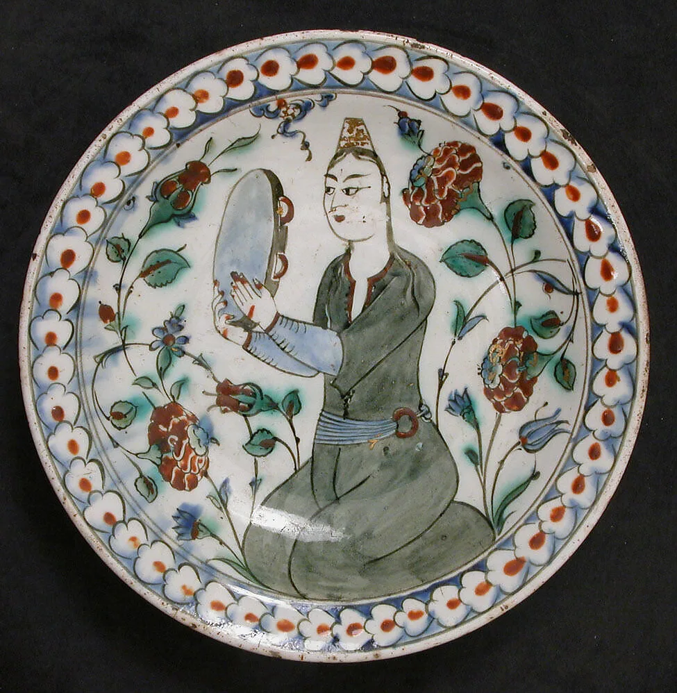 Plate Depicting a Woman Playing Tambourine — Unknown