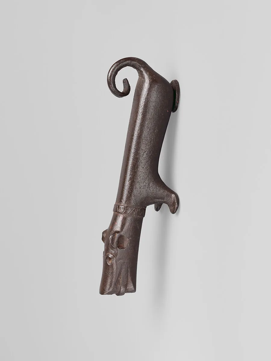 Door knocker in the shape of a small dog — Unknown