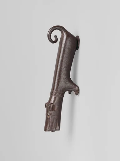 Door knocker in the shape of a small dog