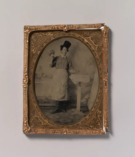 [Stone Mason in Top Hat and Apron with Mallet and Chisel]