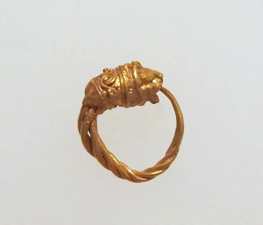 Gold earring with head of a lion