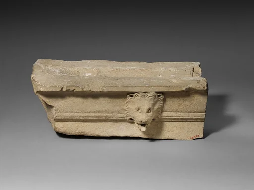 Limestone cornice with a lion’s head