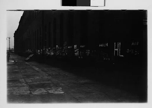 [Five 35mm Film Frames: Graffiti on Wall, Man and Boxes in Front of Graffiti-Covered Wall, Chalk Drawing, New York City]