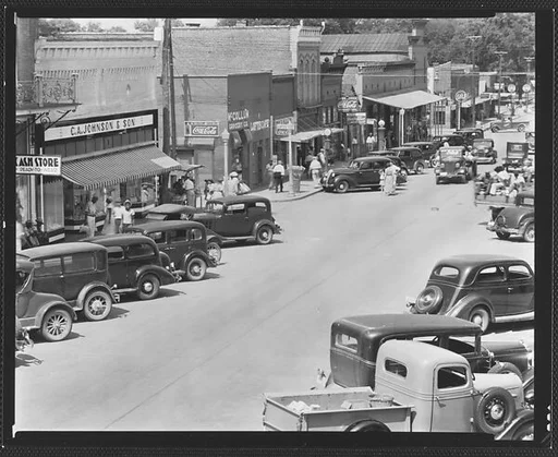[Parked Cars and Pedestrians on Main Street, Greensboro, Alabama]