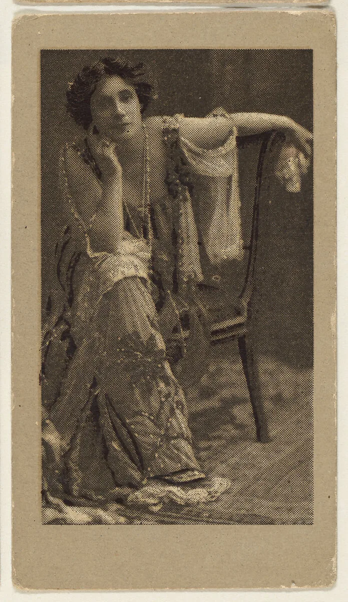 Portrait of a woman, seated, with her elbow resting on her knee, from the "Girls" series (T66), issued with Hunter Dog Cigarros by S. Monday & Sons — S. Monday & Sons, Brooklyn, New York