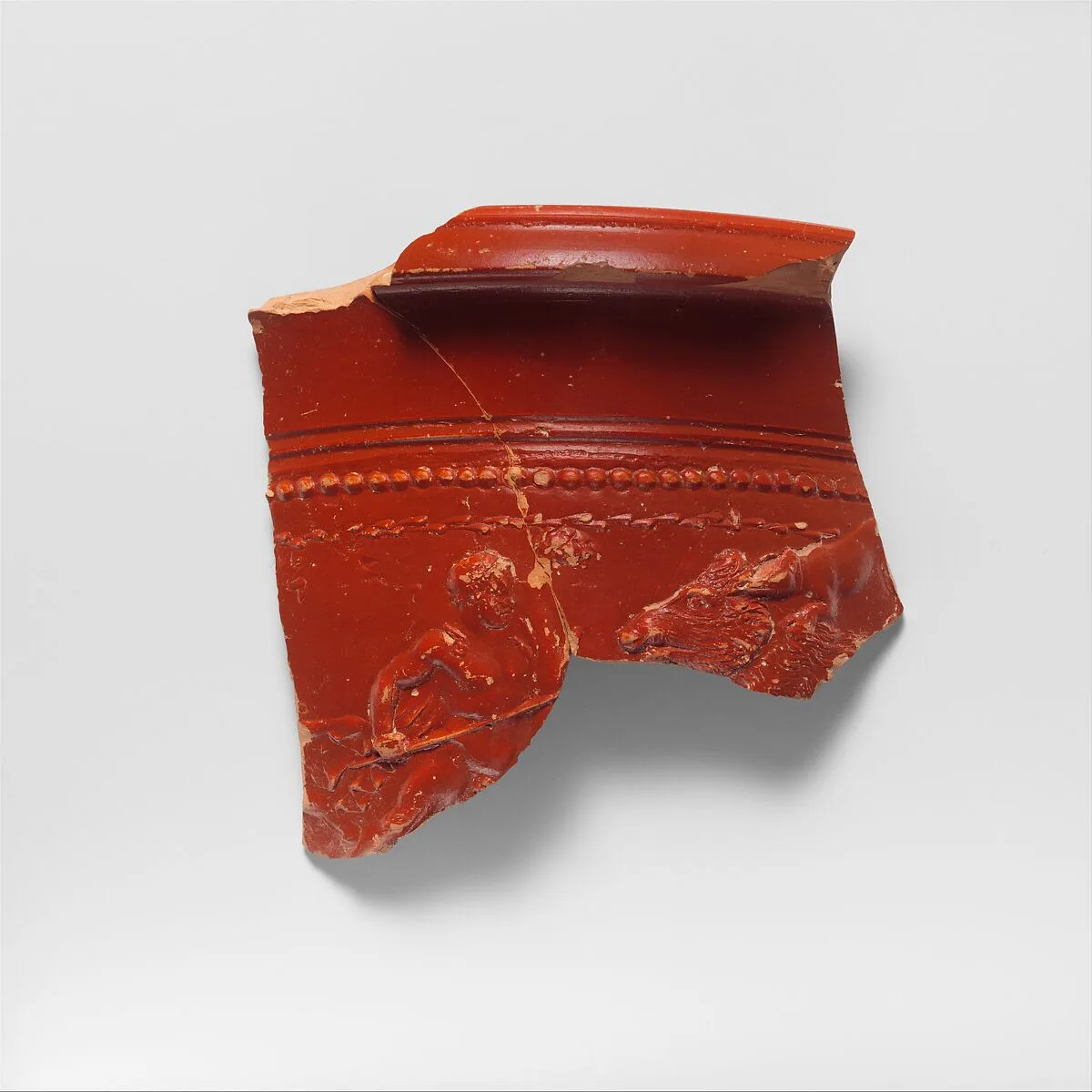 Terracotta bowl fragment depicting a boar hunt — Unknown