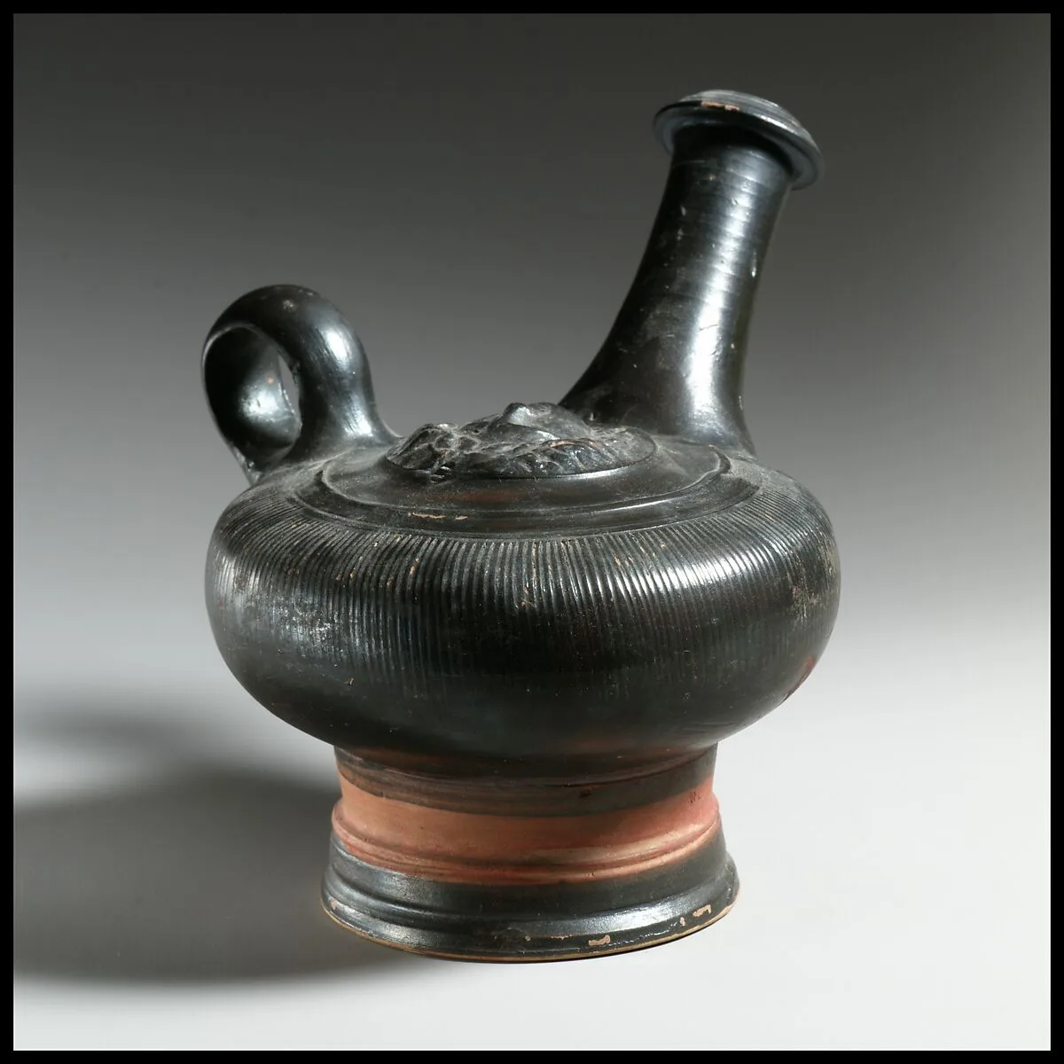 Terracotta guttus (flask with handle and vertical spout) — Unknown