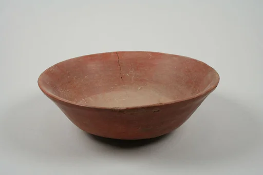 Undecorated painted bowl with flaring sides