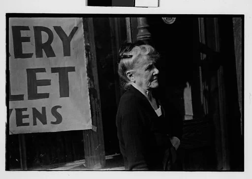 [Two 35mm Film Frames: Old Woman on Sidewalk, New York City]