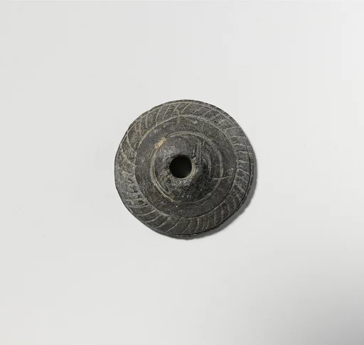 Schist spindle whorl