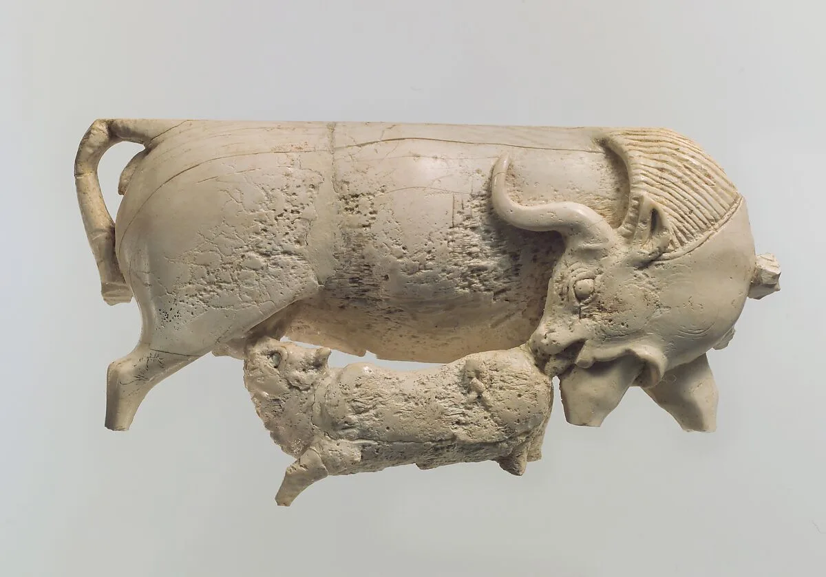 Openwork furniture plaque showing a cow suckling a calf — Unknown
