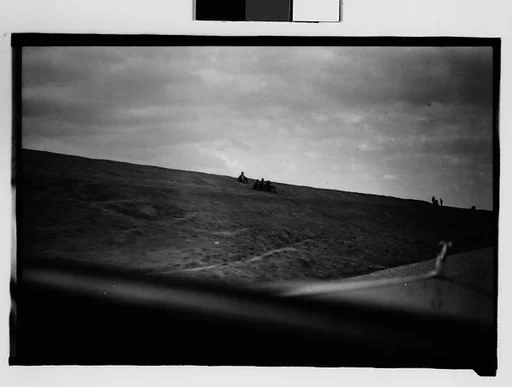 [People on Levee, From Moving Automobile, New Orleans Vicinity, Louisiana]