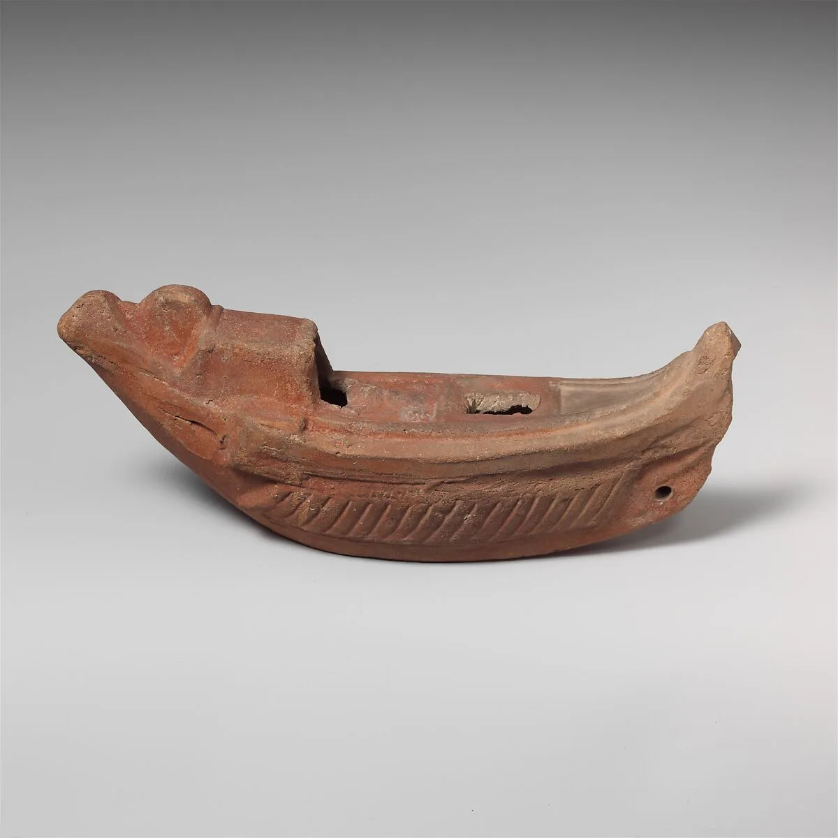 Terracotta oil lamp in the shape of a boat — Unknown