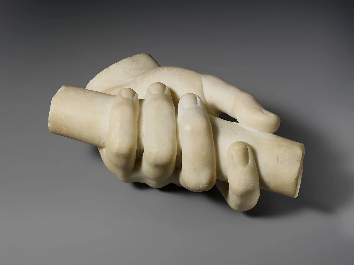 Marble left hand holding a scroll — Unknown