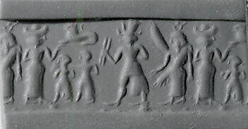 Cylinder seal and modern impression: war goddess flanked by goddesses with Egyptian-style sun-disk headdress and vertical wings