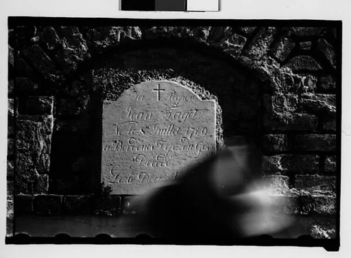 [Wall Tomb Plaque with Passing Pedestrian in Foreground, New Orleans, Louisiana]