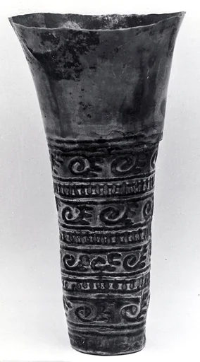 Beaker with scroll ornamentation