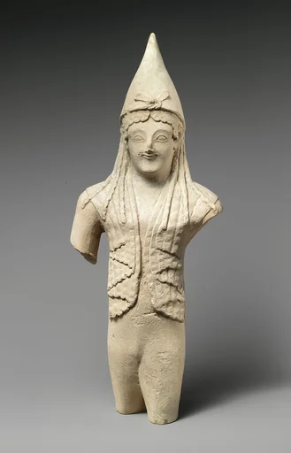 Limestone statuette of a youthful votary wearing a pointed cap