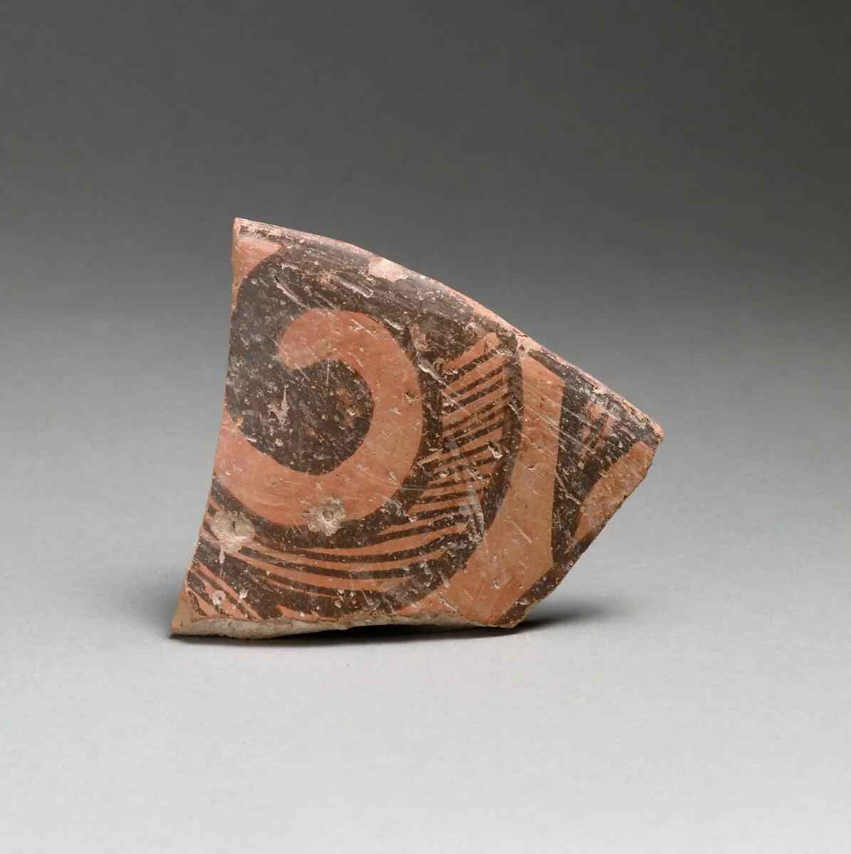 Terracotta rim fragment with spiral design — Unknown