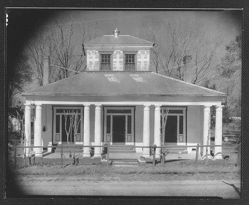 [Building with Paired Columns and Painted Trim Doorways]