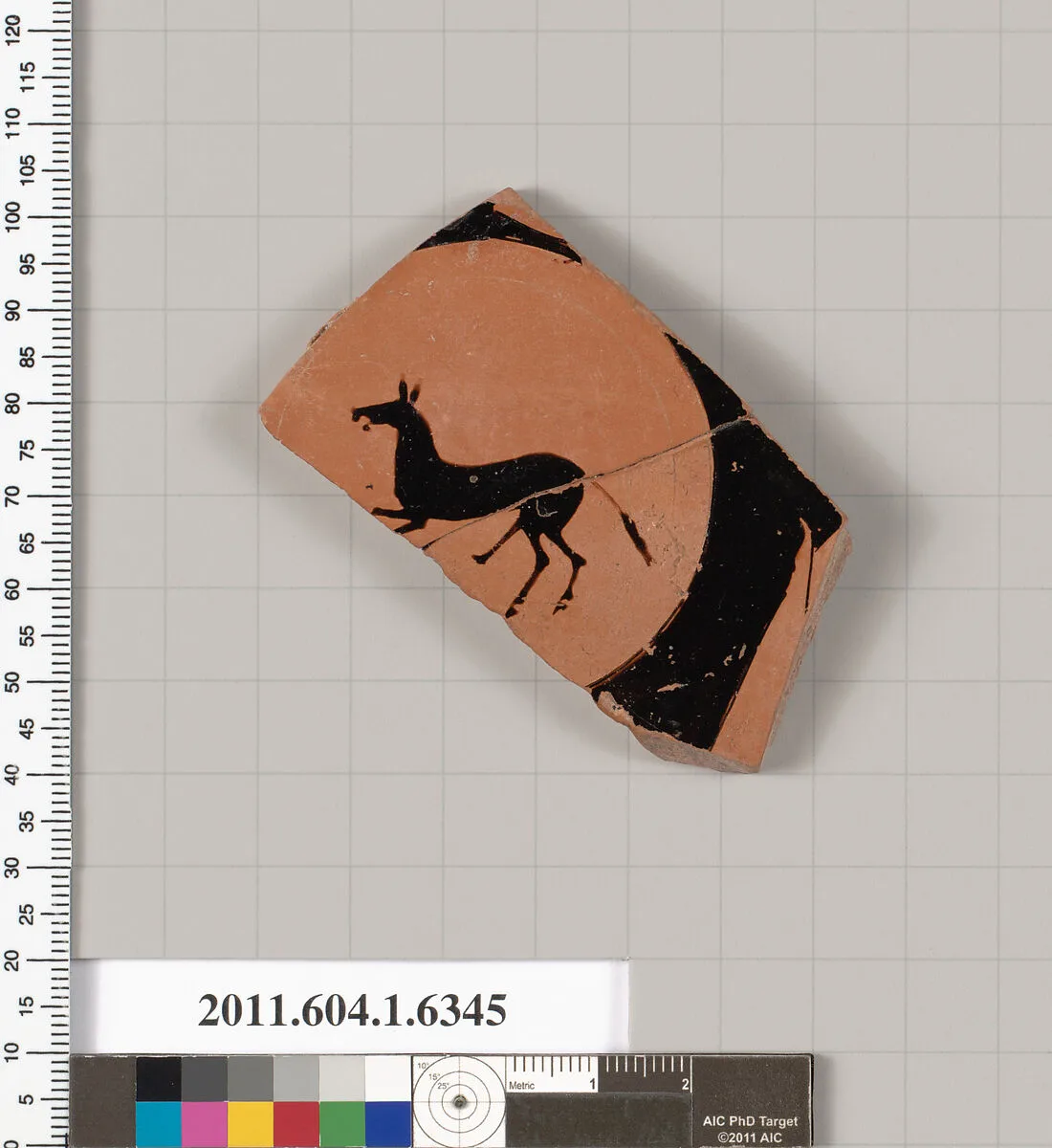 Terracotta fragment of a kylix (drinking cup) — Onesimos