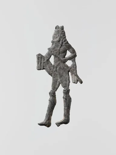 Lead figure of a man with a spear or scepter