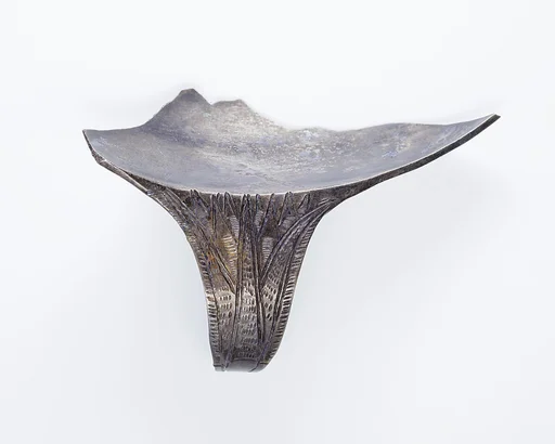 Rim fragment with handle from a shallow strainer