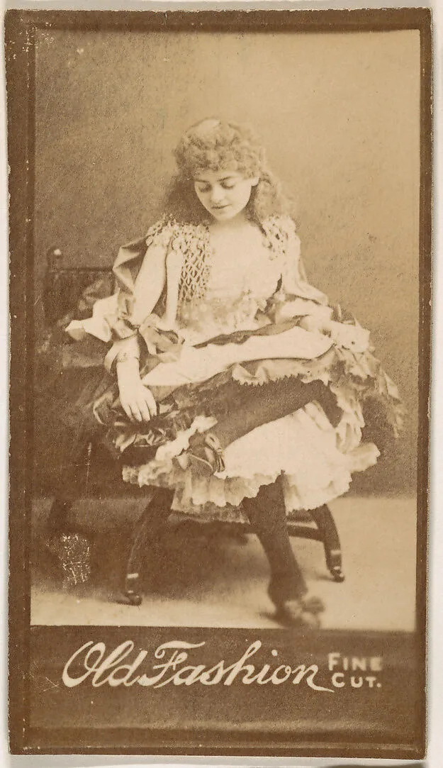 Actress gazing down at lap, from the Actresses series (N664) promoting Old Fashion Fine Cut Tobacco — Unknown
