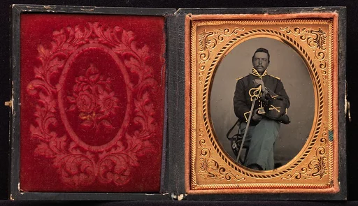 [Union Cavalry Officer Displaying Sword, Holding Hat, Seated in Studio]