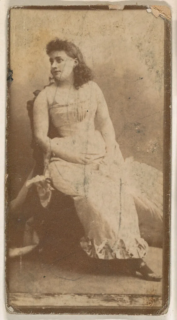 Actress seated with hands on lap, from the Actresses series (N664) promoting Old Fashion Fine Cut Tobacco — Unknown